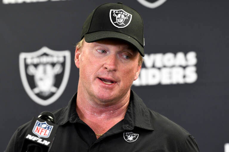 FILE - In this Sept. 19, 2021, file photo, Las Vegas Raiders head coach Jon Gruden meets with the media following an NFL football game against the Pittsburgh Steelers in Pittsburgh. Gruden is out as coach of the Raiders after emails he sent before being hired in 2018 contained racist, homophobic and misogynistic comments. A person familiar with the decision said Gruden is stepping down after The New York Times reported that Gruden frequently used misogynistic and homophobic language directed at Commissioner Roger Goodell and others in the NFL