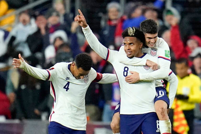 United States' Weston McKennie celebrates his goal with Tyler Adams, left, and Christian Pulisic during the second half of a FIFA World Cup qualifying soccer match against Mexico, Friday, Nov. 12, 2021, in Cincinnati. The U.S. won 2-0