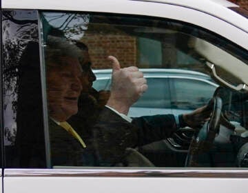 John ''Johnny Doc'' Dougherty gestures as he is driven from the federal courthouse in Philadelphia, Monday, Nov. 15, 2021. Dougherty was found guilty of conspiracy charges Monday in his corruption trial. (AP Photo/Matt Rourke)