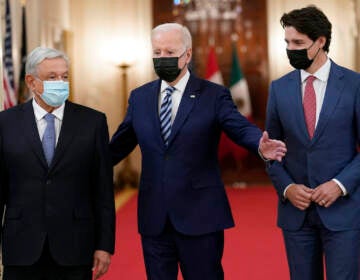 President Joe Biden walks with Mexican President Andrés Manuel López Obrador and Canadian Prime Minister Justin Trudeau during a meeting in the East Room of the White House in Washington, Thursday, Nov. 18, 2021