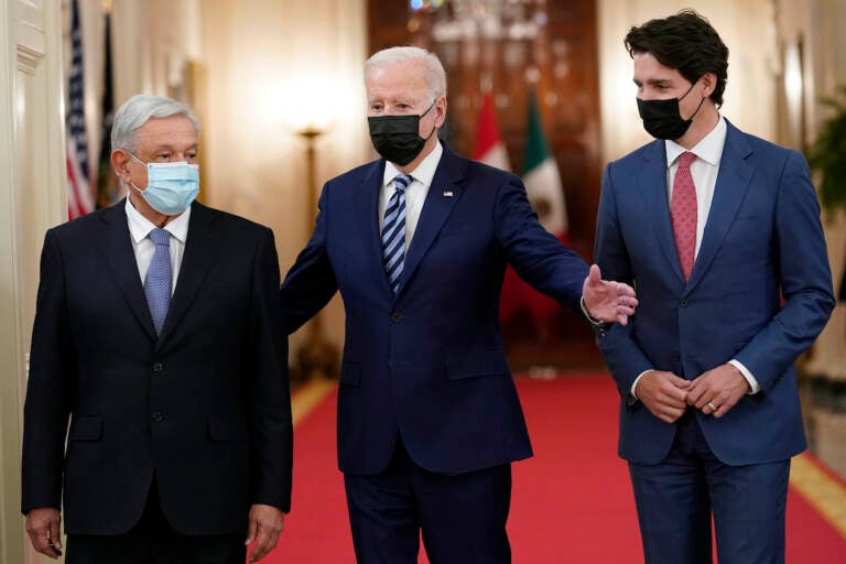 President Joe Biden walks with Mexican President Andrés Manuel López Obrador and Canadian Prime Minister Justin Trudeau during a meeting in the East Room of the White House in Washington, Thursday, Nov. 18, 2021