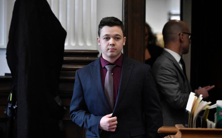 Kyle Rittenhouse enters the courtroom to hear the verdicts in his trial at the Kenosha County Courthouse in Kenosha, Wis., on Friday, Nov. 19, 2021. Rittenhouse has been acquitted of all charges after pleading self-defense in the deadly Kenosha shootings that became a flashpoint in the nation’s debate over guns, vigilantism and racial injustice. The jury came back with its verdict afer close to 3 1/2 days of deliberation