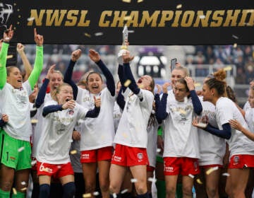 Washington players celebrate after defeating Chicago in the NWSL Championship soccer match against Chicago Saturday, Nov. 20, 2021, in Louisville, Kentucky
