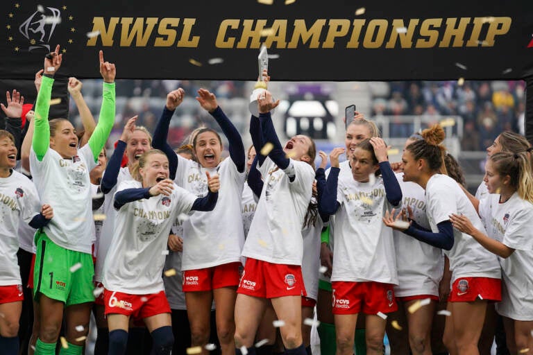 Washington players celebrate after defeating Chicago in the NWSL Championship soccer match against Chicago Saturday, Nov. 20, 2021, in Louisville, Kentucky