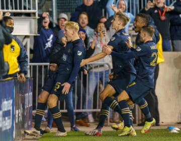 Philadelphia Union's Jakob Glesnes, left, celebrates his goal with fans and teammates during extra time in an MLS playoff soccer match against the New York Red Bulls, Saturday, Nov. 20, 2021, in Chester, Pa. The Union won 1-0 in extra time.