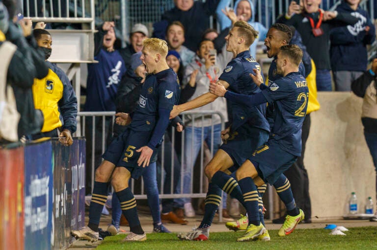 Philadelphia Union's Jakob Glesnes, left, celebrates his goal with fans and teammates during extra time in an MLS playoff soccer match against the New York Red Bulls, Saturday, Nov. 20, 2021, in Chester, Pa. The Union won 1-0 in extra time.