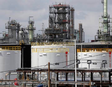 Storage is shown at the Marathon Petroleum Corp. refinery in Detroit, Tuesday, April 21, 2020. The world is awash in oil, there's little demand for it and we're running out of places to put it. That in a nutshell explains this week's strange and unprecedented action in the market for crude oil futures contracts, where traders essentially offered to pay someone else to deal with the oil they were due to have delivered next month.(AP Photo/Paul Sancya)