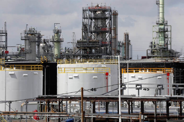 Storage is shown at the Marathon Petroleum Corp. refinery in Detroit, Tuesday, April 21, 2020. The world is awash in oil, there's little demand for it and we're running out of places to put it. That in a nutshell explains this week's strange and unprecedented action in the market for crude oil futures contracts, where traders essentially offered to pay someone else to deal with the oil they were due to have delivered next month.(AP Photo/Paul Sancya)