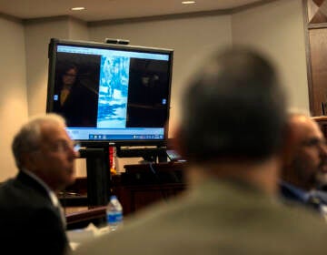 Prosecutor Linda Dunikoski, far right, plays a video the jury asked to see as part of their deliberation during the trial of Greg McMichael and his son, Travis McMichael, and a neighbor, William 