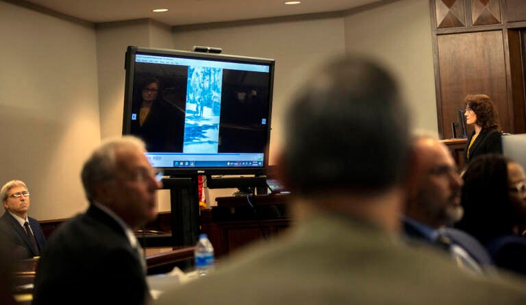 Prosecutor Linda Dunikoski, far right, plays a video the jury asked to see as part of their deliberation during the trial of Greg McMichael and his son, Travis McMichael, and a neighbor, William 