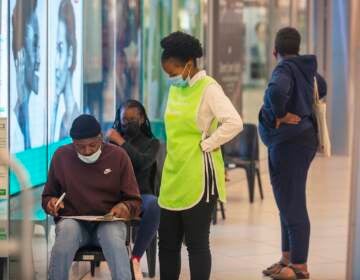 People lineup to get vaccinated at a shopping mall in Johannesburg, South Africa, Friday Nov. 26, 2021. A new coronavirus variant has been detected in South Africa that scientists say is a concern because of its high number of mutations and rapid spread among young people in Gauteng, the country’s most populous province