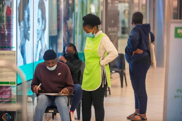 People lineup to get vaccinated at a shopping mall in Johannesburg, South Africa, Friday Nov. 26, 2021. A new coronavirus variant has been detected in South Africa that scientists say is a concern because of its high number of mutations and rapid spread among young people in Gauteng, the country’s most populous province