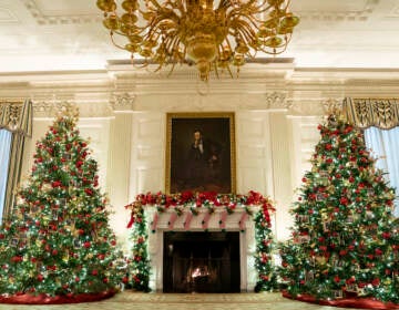 The State Dining Room of the White House is decorated for the holiday season during a press preview of the White House holiday decorations, Monday, Nov. 29, 2021, in Washington. (AP Photo/Evan Vucci)