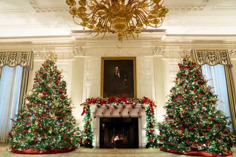 The State Dining Room of the White House is decorated for the holiday season during a press preview of the White House holiday decorations, Monday, Nov. 29, 2021, in Washington. (AP Photo/Evan Vucci)