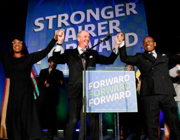 Lt. Gov. Sheila Oliver, left, New Jersey Governor, Phil Murphy center, and LeRoy Jones, chairman of the state's Democratic committee, right, celebrate at Convention Hall after winning gubernatorial race against Jack Ciattarelli. 
Wednesday, Nov. 3, 2021, in Asbury Park, N.J. 
(AP Photo/Noah K. Murray)