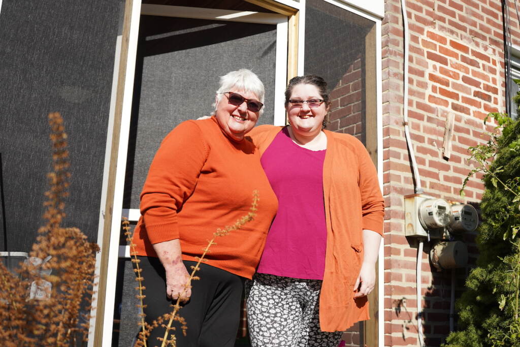 Gillian (L) and Caroline Lancaster (R) fashioned their porch into a makeshift food pantry during the pandemic with the help of Buy Nothing Lansdowne.