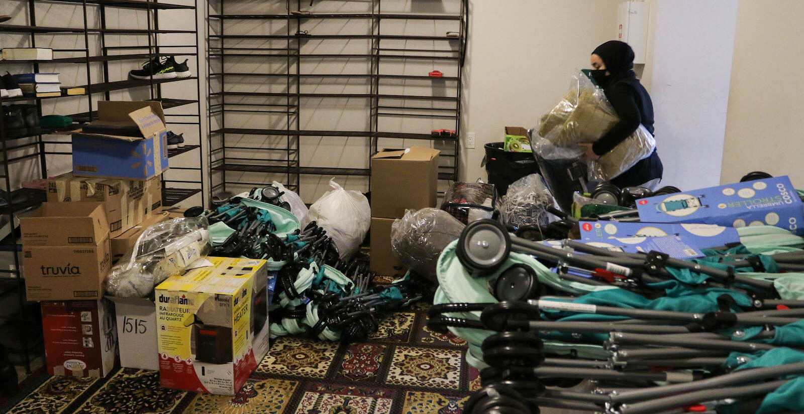 A donation pack up for incoming Afghan refugees run by AOPxSOLA and members of Imam Ali Masjid Mosque at Imam Ali Masjid Mosque in Pennsauken, NJ on 11/14/21.
[DANIELLA HEMINGHAUS]