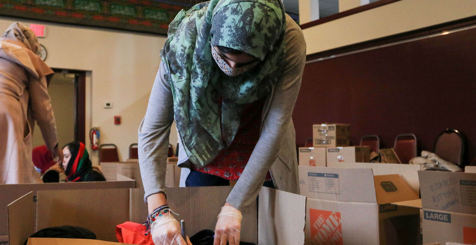 Tahmina Achekzai, communications manager at AOPxSOLA, labeling boxes.
A donation pack up for incoming Afghan refugees run by AOPxSOLA and members of Imam Ali Masjid Mosque at Imam Ali Masjid Mosque in Pennsauken, NJ on 11/14/21.
[DANIELLA HEMINGHAUS]