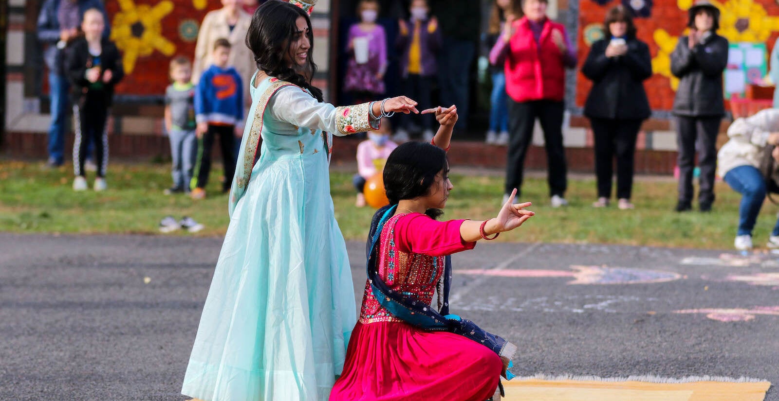 Saanvi Potnis (left) and Arya Haridas (right) dance at the annual Diwali festival