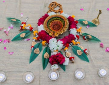 Display of flowers and candles for a Diwali celebration in Doylestown, Pa. in 2021.