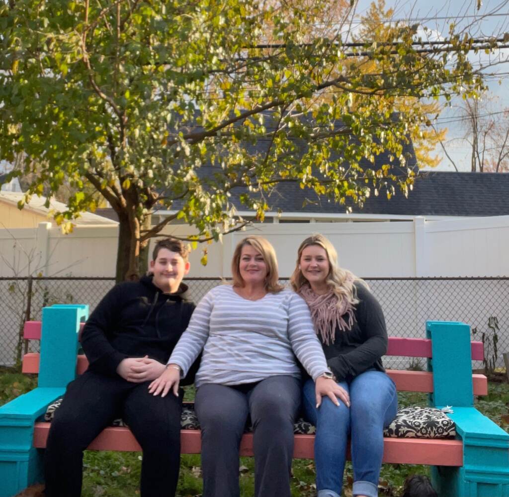 Kelly Larkin sits between her two youngest kids