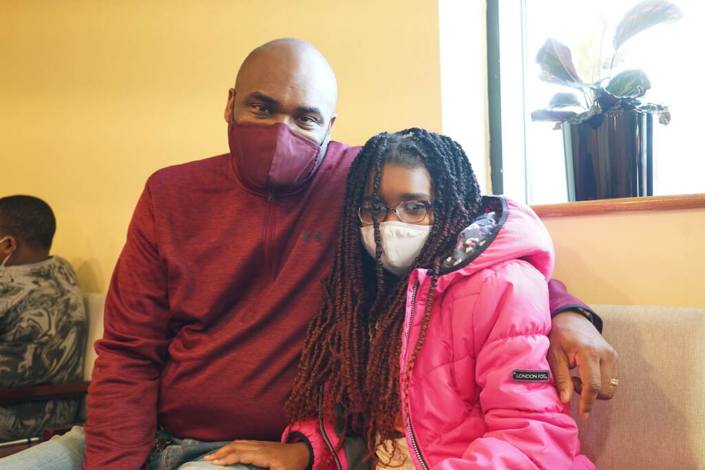 Leon McCrea (L) said that getting his daughter, Noelle, vaccinated matters and so was the choice to have it done at the Black Doctors COVID-19 Consortium’s first weekend of vaccinations for younger children at the Dr. Ala Stanford Center for Health Equity (ASHE) in North Philadelphia