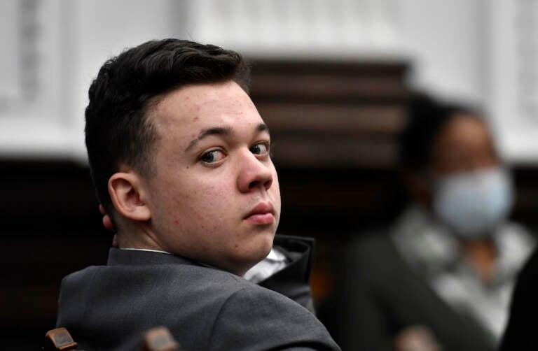 Kyle Rittenhouse looks back as attorneys argue about the charges that will be presented to the jury during proceedings at the Kenosha County Courthouse in Kenosha, Wis., on Friday, Nov. 12, 2021.(Sean Krajacic/The Kenosha News via AP, Pool)