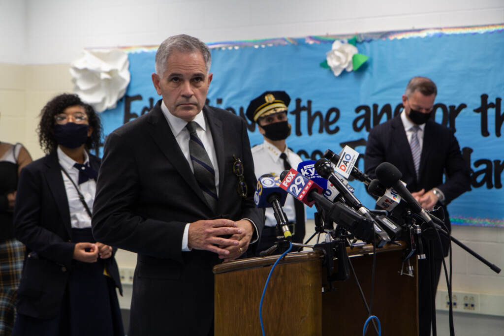 Philadelphia District Attorney Larry Krasner speaks from a podium during a press conference