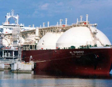 A tanker ship being loaded with LNG