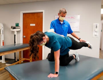 Brian Catania works aide Taylor Putnam through the Row Dog, one of the six core activation exercises he and Travis Ross developed.