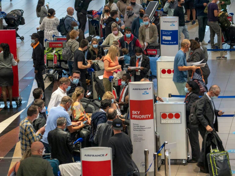 People line up to get on a flight