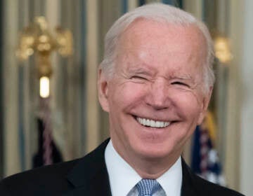 President Joe Biden smiles as he speaks about the bipartisan infrastructure bill in the State Dinning Room of the White House, Saturday, Nov. 6, 2021, in Washington. (AP Photo/Alex Brandon)