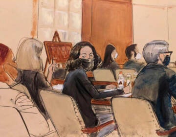 In this courtroom sketch, Ghislaine Maxwell looks over her shoulder to the courtroom audience