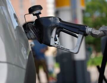 Motorists fill up their vehicles at a Shell station Thursday, July 22, 2021, in southeast Denver. Colorado drivers are facing some of the highest prices per gallon at the pump in more than a decade