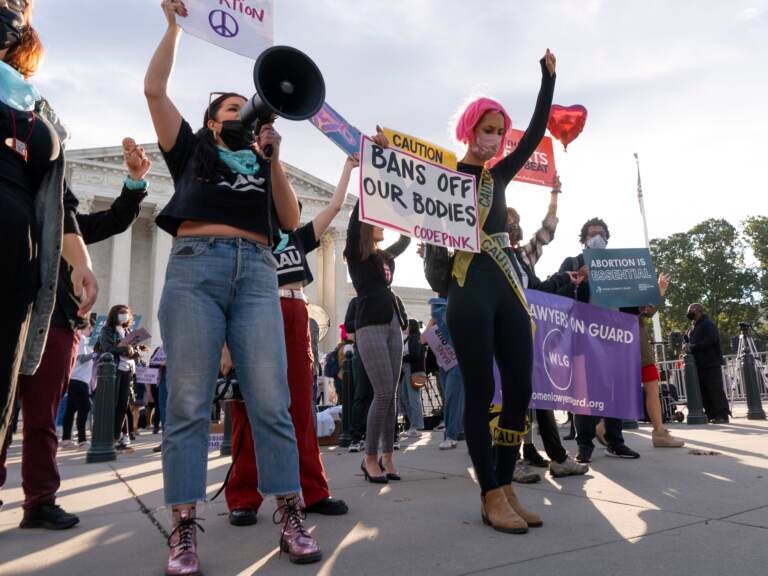 Pro-choice and anti-abortion activists rally outside the Supreme Court, Monday, Nov. 1, 2021, as arguments are set to begin about abortion by the court, on Capitol Hill in Washington. (AP Photo/Jacquelyn Martin)