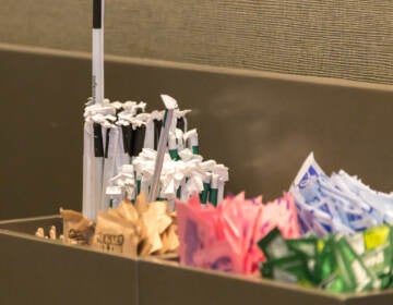 NEW YORK, USA - MAY 15, 2019: Counter in Starbucks cafe with Straws and sugar to pick up to go