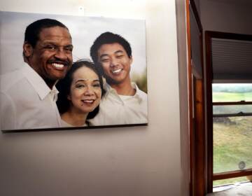 A family photo hangs on a wall in the dining room