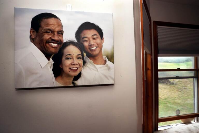 A family photo hangs on a wall in the dining room