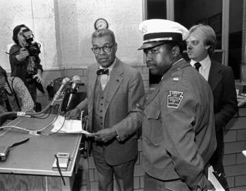 FILE - In this Nov. 2, 1981, file photo, Philadelphia newspaper columnist Chuck Stone speaks with newsmen after a hostage situation ended at Pennsylvania State Correctional Institution at Graterford, Pa., as Stone mediated with inmates who were holding hostages in a kitchen area of the prison following an aborted escape attempt. Longtime journalist and educator Charles Sumner 