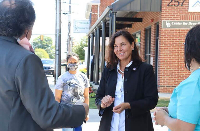 Kathy McGuiness speaking with people