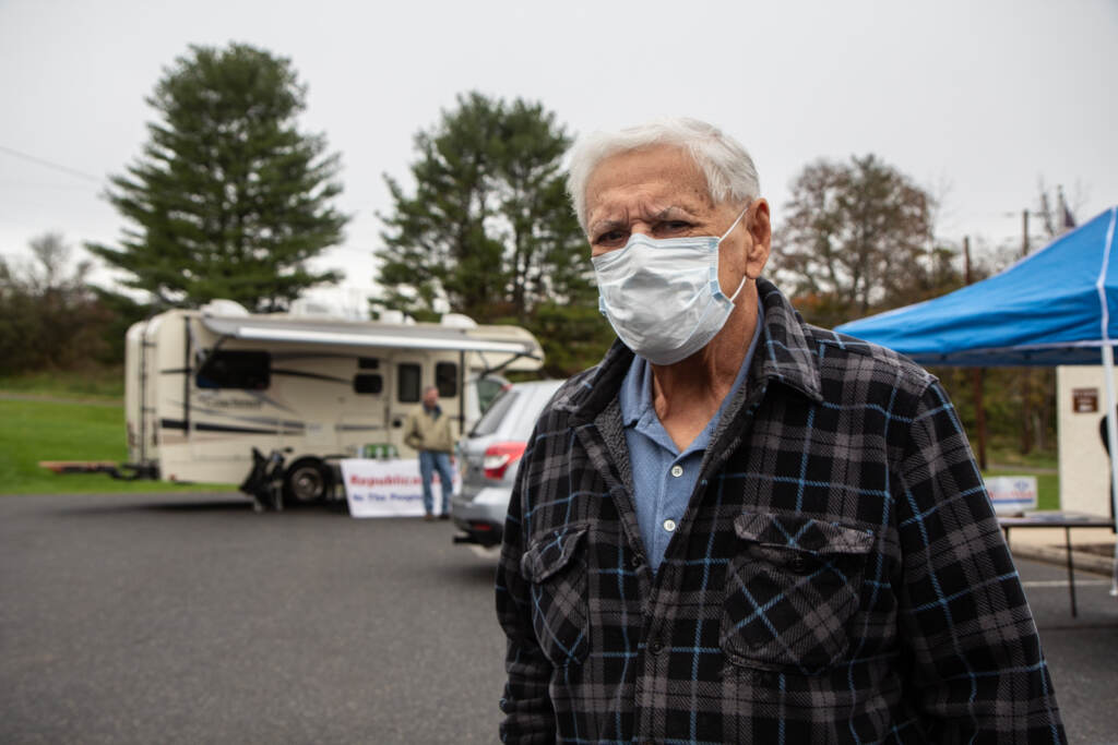 George Pavlonsky wears a face mask in a parking lot