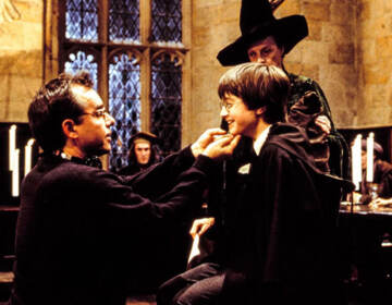 Chris Colombus directing Daniel Radcliffe on the set of Harry Potter