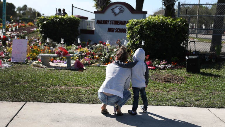 A memorial is seen outside Marjory Stoneman Douglas High School