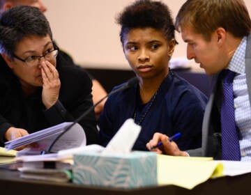 Chrystul Kizer (shown here with her lawyers in 2019) is arguing that it was self-defense when she killed the man who sexually abused her. (The Washington Post via Getty Images)