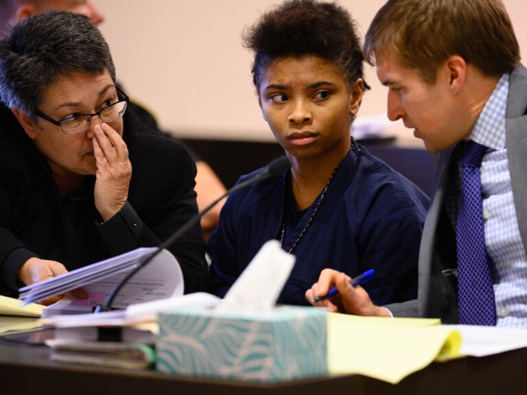 Chrystul Kizer (shown here with her lawyers in 2019) is arguing that it was self-defense when she killed the man who sexually abused her. (The Washington Post via Getty Images)