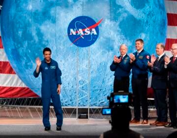 NASA astronaut Jessica Watkins (L) waves at the audience during during the astronaut graduation ceremony at Johnson Space Center in Houston Texas, on January 10, 2020. - The 13 astronauts, 11 from NASA and 2 from CSA, are the first candidates to graduate under the Artemis program and will become eligible for spaceflight, including assignments to the International Space Station, Artemis missions to the Moon, and ultimately, missions to Mars, according to NASA. (Photo by Mark Felix / AFP) (Photo by MARK FELIX/AFP via Getty Images)