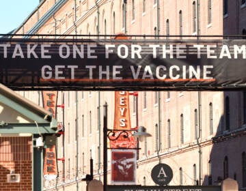 A sign outside Camden Yards in Baltimore, Maryland, encourages people to get a COVID-19 vaccine.
Mitchell Layton/Getty Images
