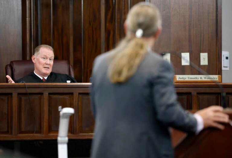 Judge Timothy Walmsley speaks to defense attorney Franklin Hogue during the jury selection process in the trial of the men charged with killing Ahmaud Arbery at the Glynn County Superior Court, on October 27, 2021 in Brunswick, Georgia. Greg and Travis McMichael and their neighbor, William 