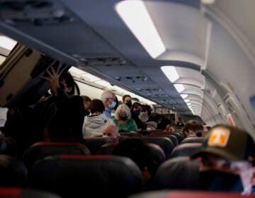 Passengers deplane from an airplane after landing at the Albuquerque International Sunport on November 24, 2021 in Albuquerque, New Mexico. FAA expects the number of travelers for Thanksgiving to reach pre-pandemic levels, with more than 53 million people traveling in total in the days leading up to the holiday. (Photo by Anna Moneymaker/Getty Images)