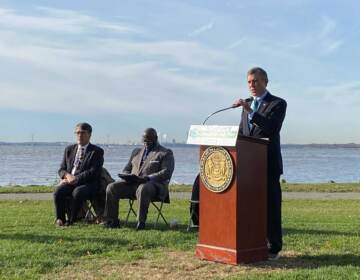 Gov. Carney speaking at a podium.